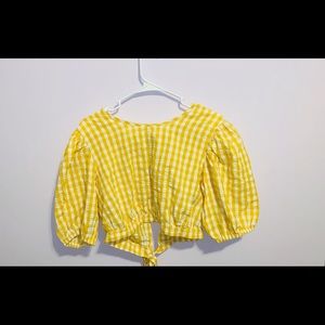 Yellow gingham cropped shirt with open backing.